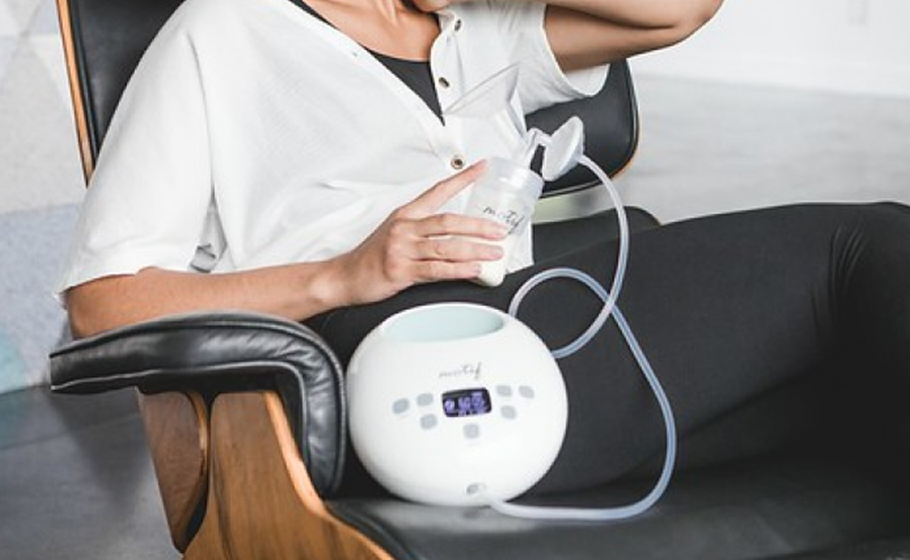 A woman sits comfortably with a Motif Luna
