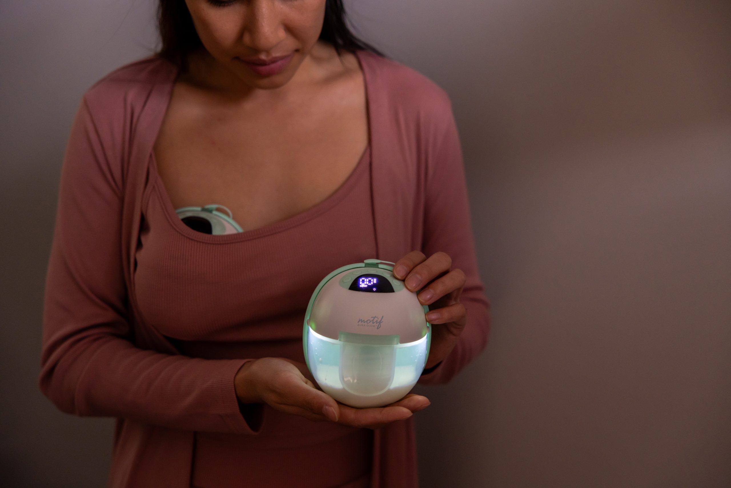 The Aura Glow Pump A mom showcasing the glow in the dark functionality of the Motif Aura Glow