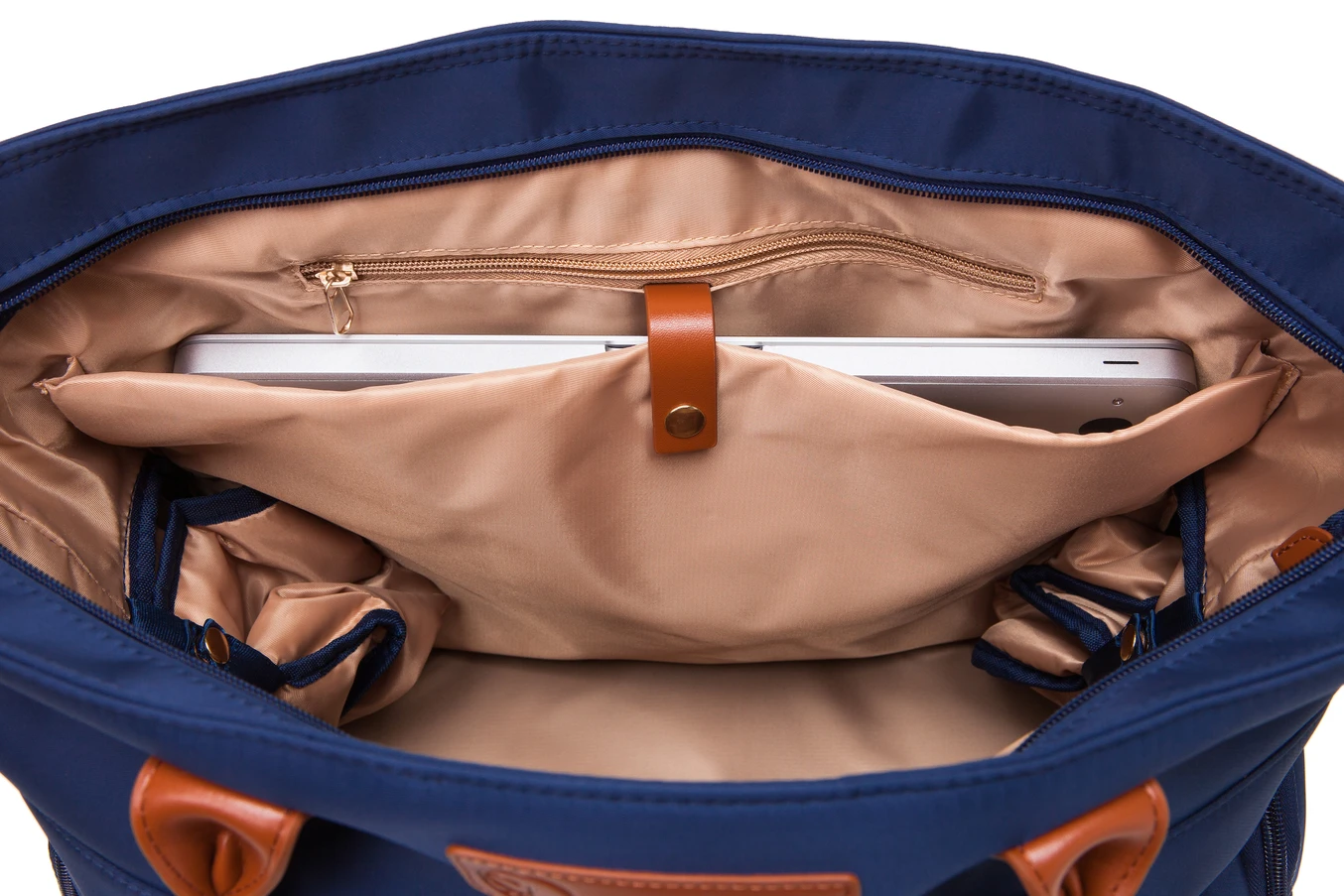 The inside of an Abby (Navy) bag fits a laptop