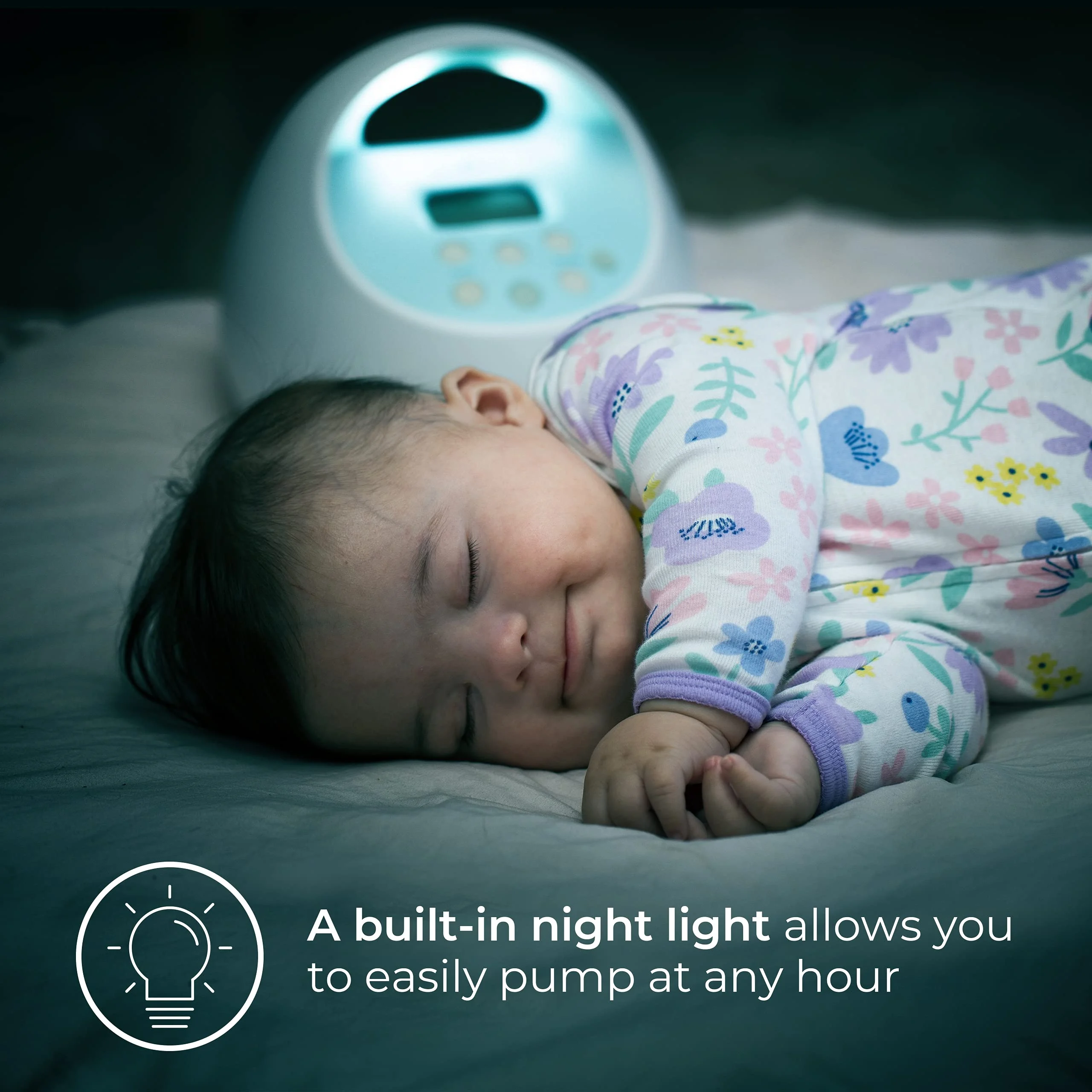 A baby sleeps next to the Spectra S1